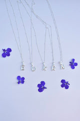 Smykke med bokstav-sølv